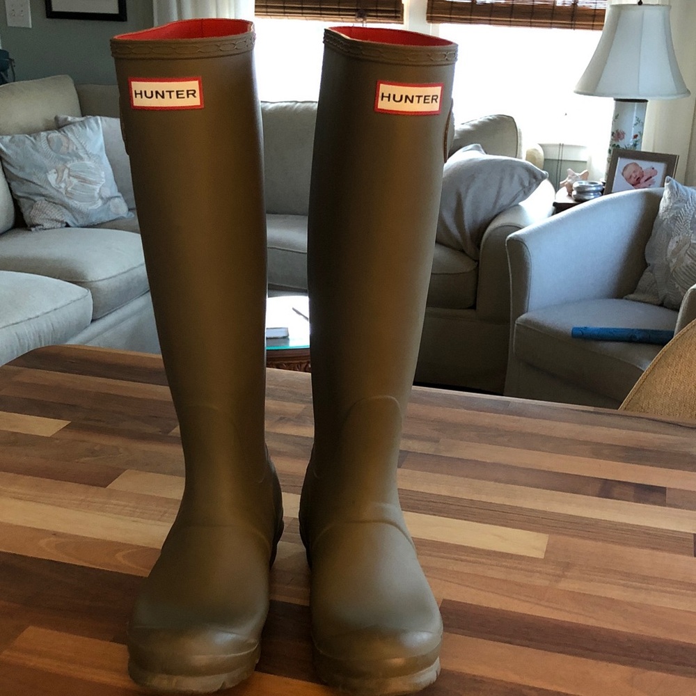 Tall rubber boots on table